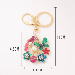 Porte-clés papillon et fleurs coloré avec strass, perle et coccinelle en métal doré