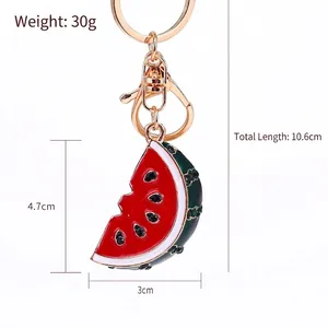 Creative watermelon slice keychain with red enamel and sparkling rhinestones on gold metal