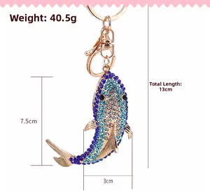 Detailed view of rhinestone fish keychain measuring 13cm in length and weighing 40.5g
