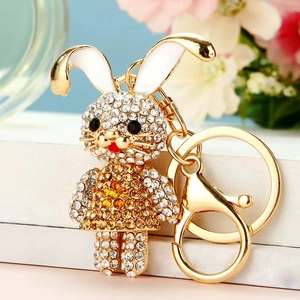Close-up of golden zodiac bunny keychain with rhinestones and enamel details