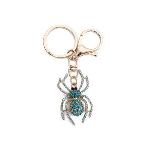 Creative spider keychain with light blue rhinestones on a gold metal base and lobster clasp