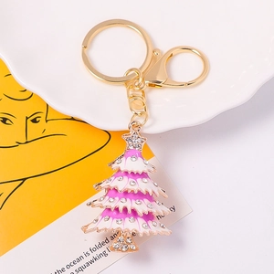 Detail of Christmas tree keychain with purple enamel and sparkling crystal rhinestones