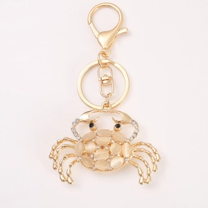 Gold crab keychain with opal stones and sparkling rhinestones for bags and accessories