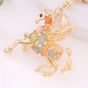 Goldener Pegasus-Schlüsselanhänger mit bunten Katzenaugen-Steinen und Strass
