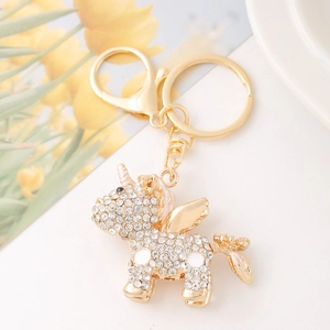 Detailed view of a golden unicorn keychain with sparkling rhinestones and lobster clasp