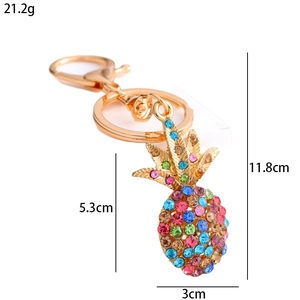 Detailed view of colorful rhinestone pineapple keychain with dimensions and weight