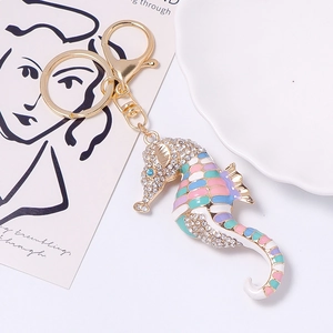 Close-up of seahorse keychain with colorful enamel and sparkling crystal rhinestones