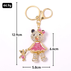 Sparkling rhinestone teddy bear keychain in gold metal with pink crystals for backpack charm