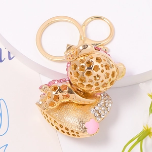 Portachiavi orsetto in metallo dorato con strass e piccoli cuori rosa