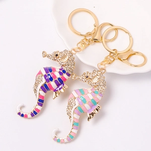 Sparkling seahorse keychains with colorful enamel and crystals in gold plating