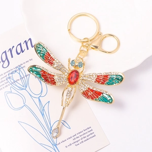 Elegant dragonfly keychain with colorful rhinestones on a gold metal clasp and ring