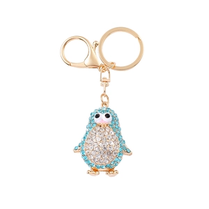Porte-clés pingouin orné de strass bleus et blancs avec fermoir en métal doré