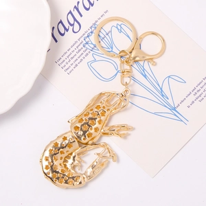 Golden lobster keychain with hollow star design and metal lobster clasp for bags