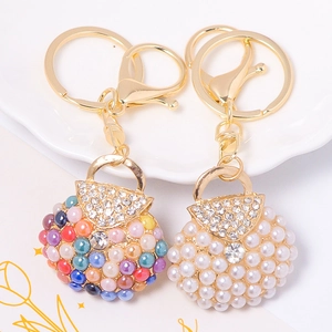 Creative handbag-shaped keychain with colorful pearls and sparkling rhinestones