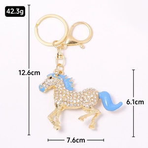Sparkling crystal rhinestone horse keychain in golden metal with blue enamel detailing