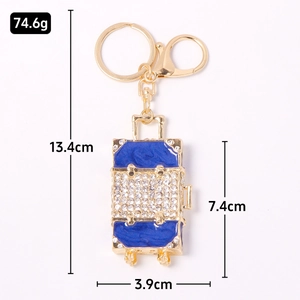 Porte-clés valise strass bleus avec dimensions 13,4 cm de long et poids de 74,6 g