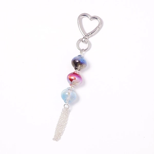 Luminous beaded keychain featuring gradient resin beads and elegant metal tassels on silver ring