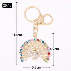 Colorful peacock rhinestone metal keychain with gold alloy frame and dimensions shown