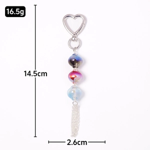 Luminous star beaded keychain with metal tassel and heart clasp shown in dimensions