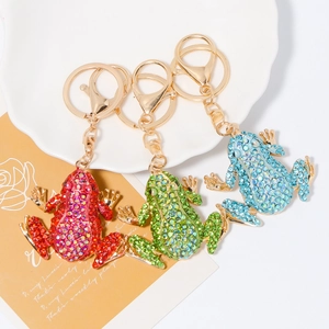 Three creative metal frog keychains with sparkling rhinestones in red, green, and blue