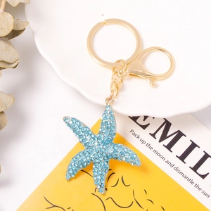 Sparkling blue rhinestone starfish keychain with gold ring and lobster clasp for women