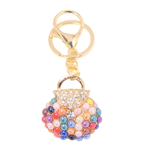 Mini handbag keychain with colorful pearls and sparkling rhinestones on golden metal ring