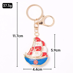 Golden sailboat keychain with colorful enamel, rhinestones and size dimensions
