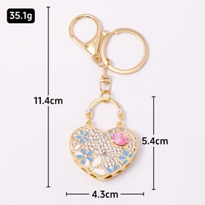 Luxury heart keychain with rhinestones, metal flowers and pink crystal gemstone