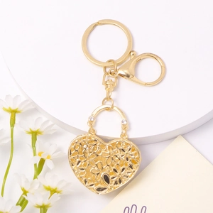 Elegant gold heart-shaped hollow flower keychain with crystal accents and lobster clasp