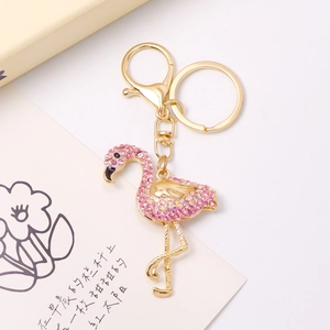 Close-up of pink crystal flamingo keychain with gold plating and lobster clasp detail