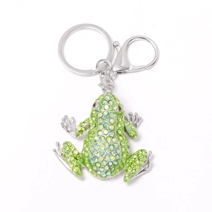 Green rhinestone frog keychain with silver metal lobster clasp on white background
