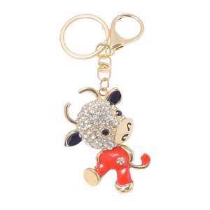 Creative rhinestone calf keychain in gold finish with red enamel and zodiac ox motif
