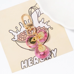 Porte-clés en perles de cristal rose avec alliage doré pour sacs et mobiles