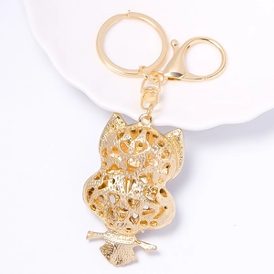 Exquisite gold alloy owl keychain with hollow heart patterns and rhinestone accents