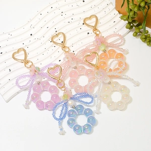 Set of five colorful beaded heart keychains with crystal flowers and bowknot charms