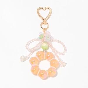 Colorful crystal beaded heart keychain with bow and floral accents for bags
