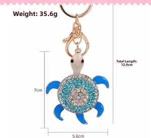 Detail of crystal turtle keychain with blue enamel legs and precise size measurements
