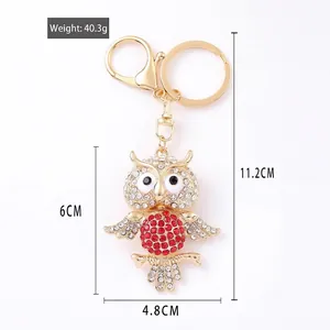 Sparkling crystal owl keychain in gold metal with dimensions 11.2cm length and 40.3g weight