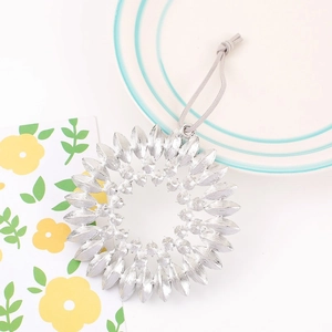 Silver sunflower crystal keychain pendant with layered marquise petals and grey hanging cord