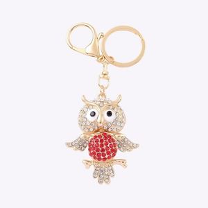 Golden owl keychain pendant with sparkling red and white rhinestones and clasp