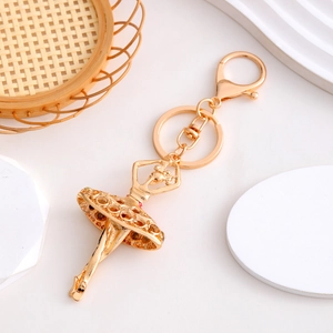 Elegant gold ballet girl keychain with sparkling rhinestones and lobster clasp on white
