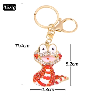 Golden rhinestone cobra snake keychain with sparkling crystals and lobster clasp accessory