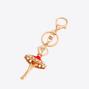 Elegant gold ballet girl keychain with red enamel dress and sparkling rhinestones for bags