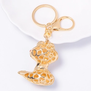 Exquisite gold cartoon snake keychain with sparkling rhinestones and hollow-out design