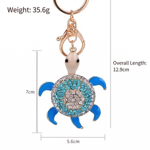 Sparkling crystal sea turtle keychain with blue enamel and gold-plated alloy details