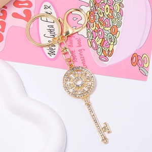 Creative gold key-shaped keychain with sparkling rhinestones and lobster clasp