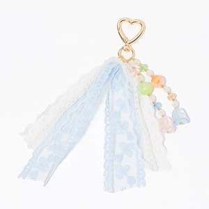 Beaded lace keychain with heart clip and blue tulip pendants on a white background