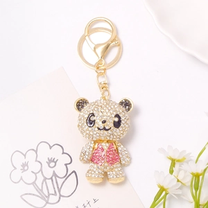 Close-up of a sparkling rhinestone panda keychain with gold ring and lobster clasp