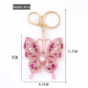 Exquisite butterfly keychain with pink crystals and gold-tone metal frame dimensions info