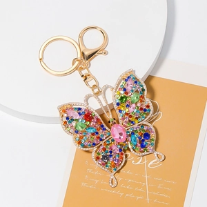 Close-up of luxury crystal butterfly keychain with colorful rhinestones and gold alloy detail